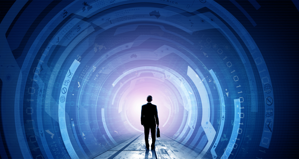 Businessman with suitcase in hands looking at virtual panel