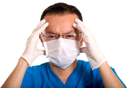 stressed male nurse over a white background